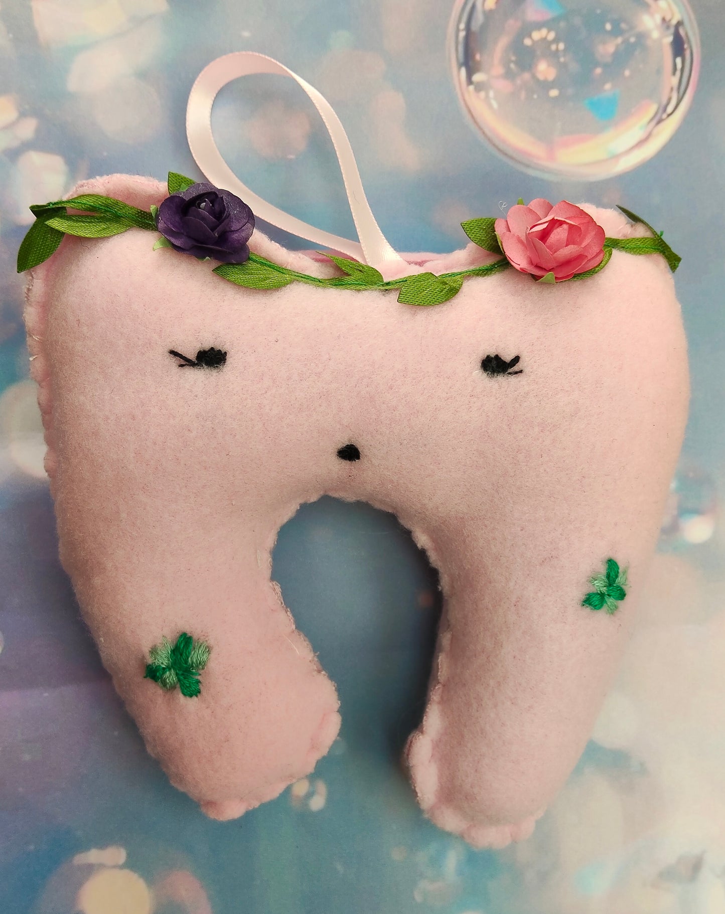 Pink tooth-shaped plush, lost tooth pouch, with floral embroided decorations, personalised with bead name on pouch. 