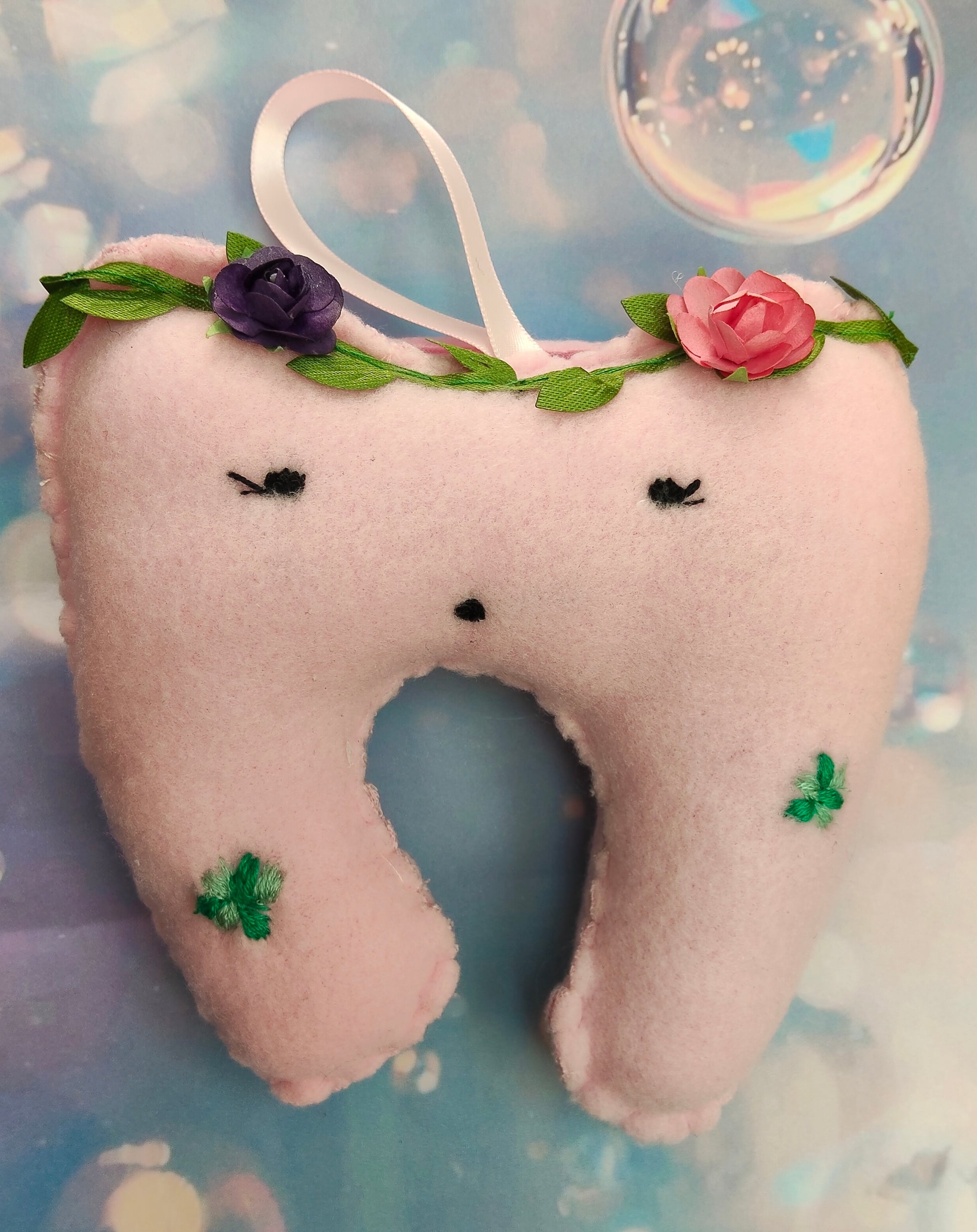 Pink tooth-shaped plush, lost tooth pouch, with floral embroided decorations, personalised with bead name on pouch. 