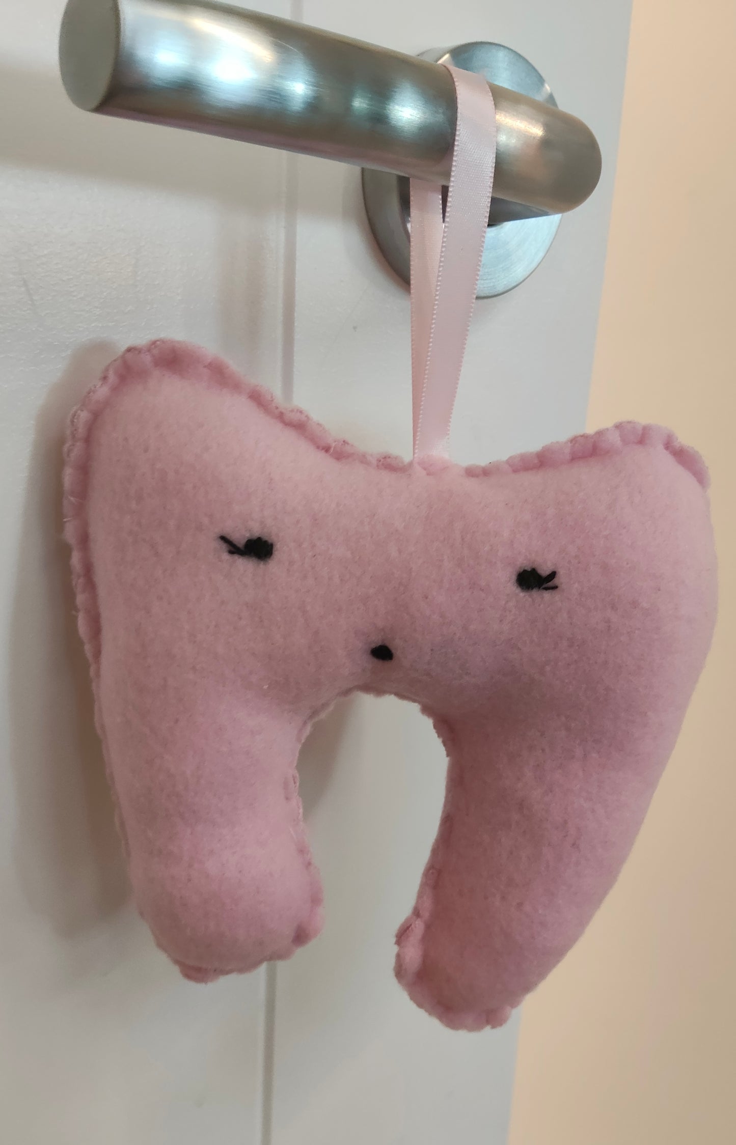 Pink tooth-shaped plush, lost tooth, tooth fairy pouch with a cute face. Personalised name pouch made with beads. 