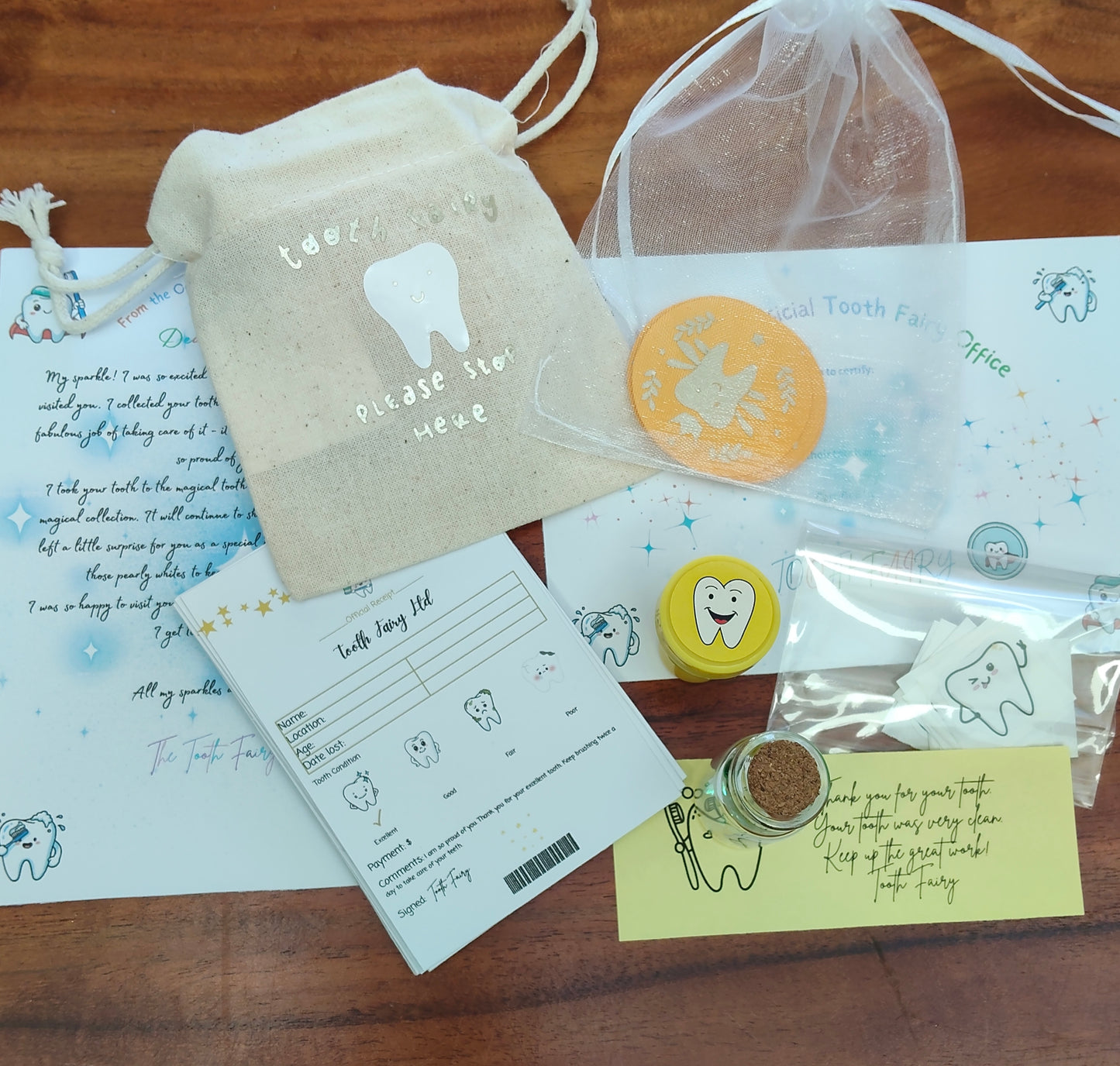 Lost Tooth, Tooth Fairy Kit includes Tooth Fairy Receipts, message in a bottle, tooth fairy letter, certificate and small tooth fairy gifts in a blue blush colour. 