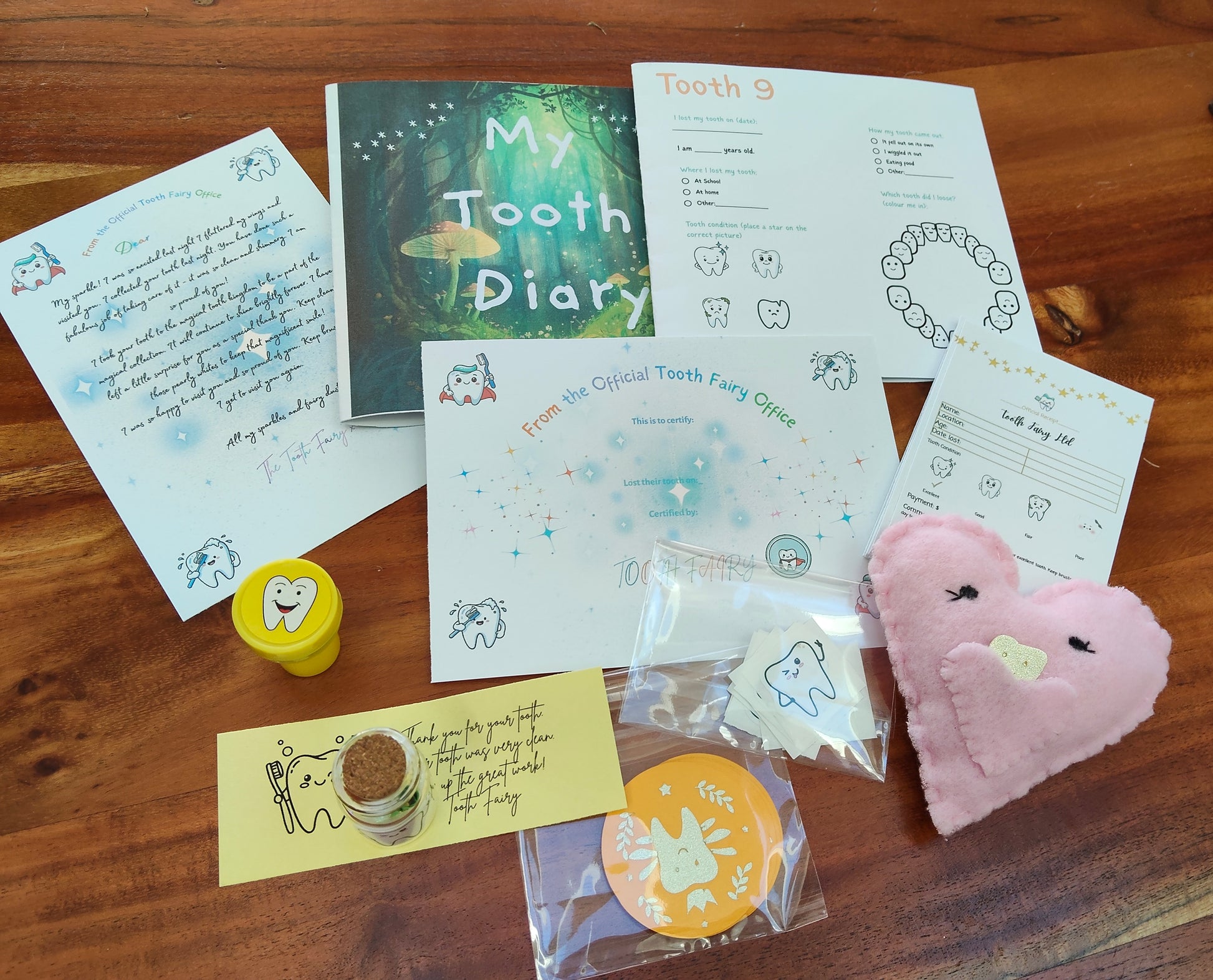 Collection of items related to a tooth fairy kit, including lost tooth pouch. 