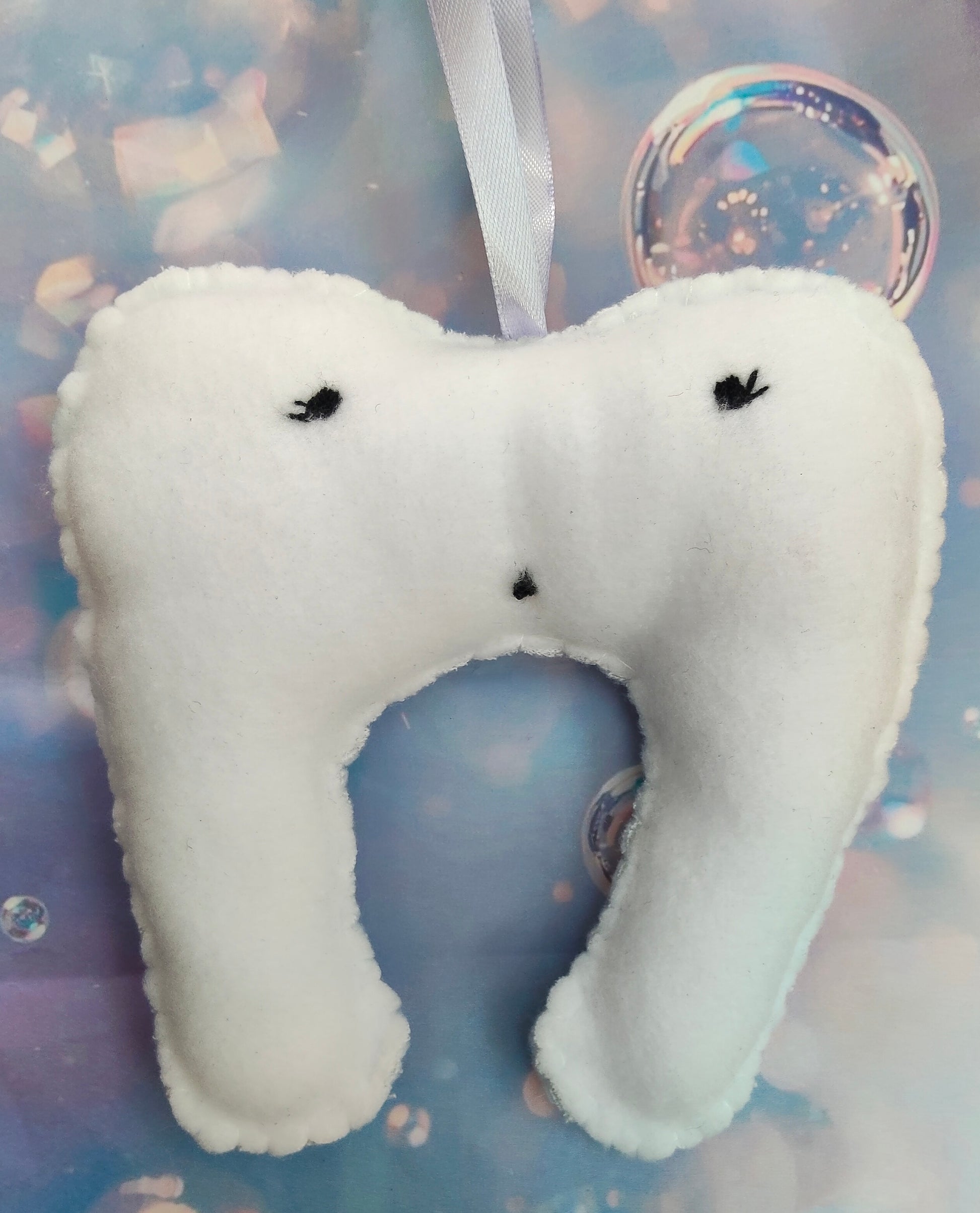 White tooth-shaped plush, lost tooth, tooth fairy pouch with a cute face. Personalised name pouch made with beads. 